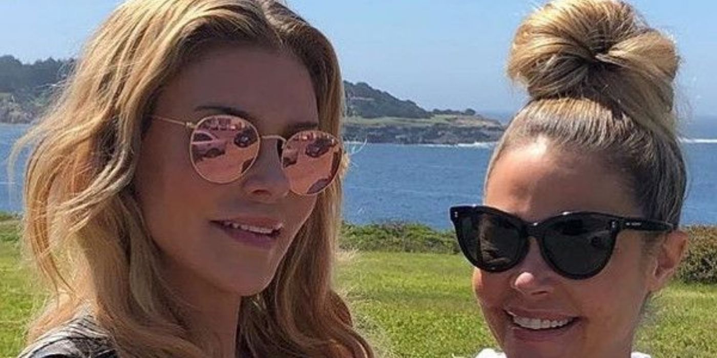 Denise and Brandi smiling on a golf course in RHOBH