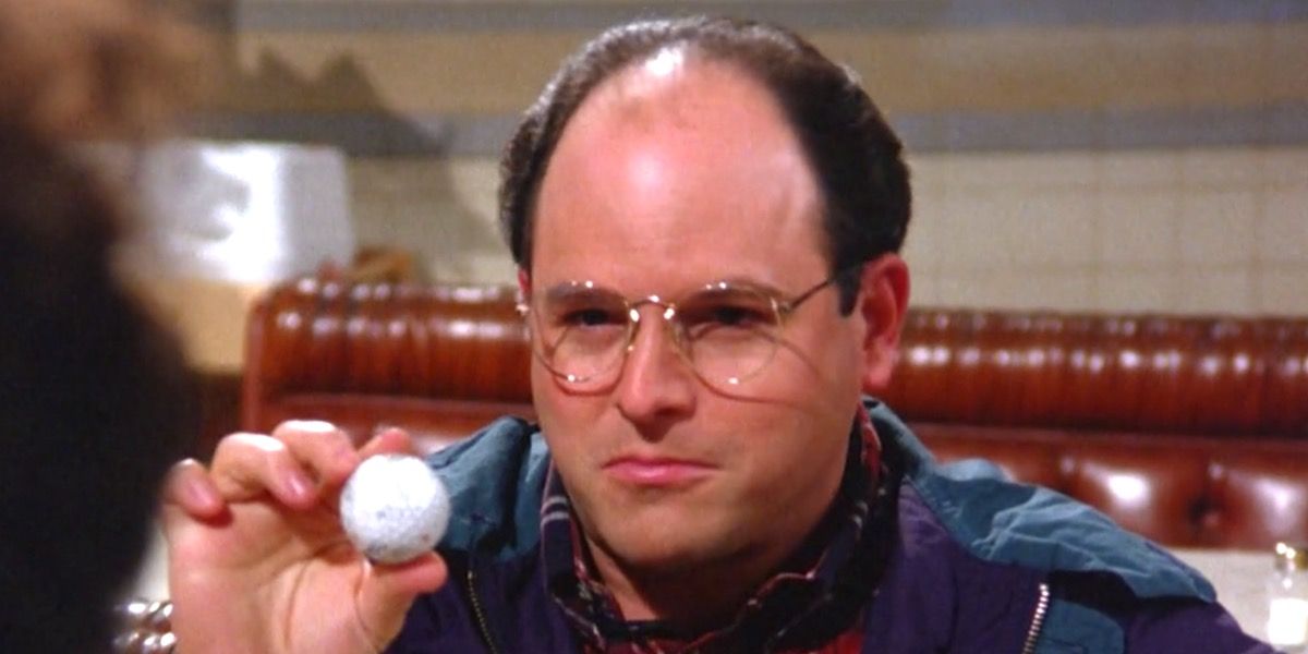 George Costanza holding up a golf ball in Seinfeld