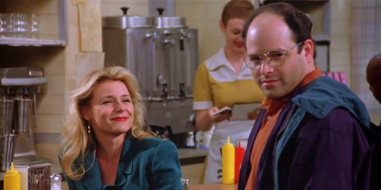 George stands in front of a woman at Monk's Cafe in Seinfeld 