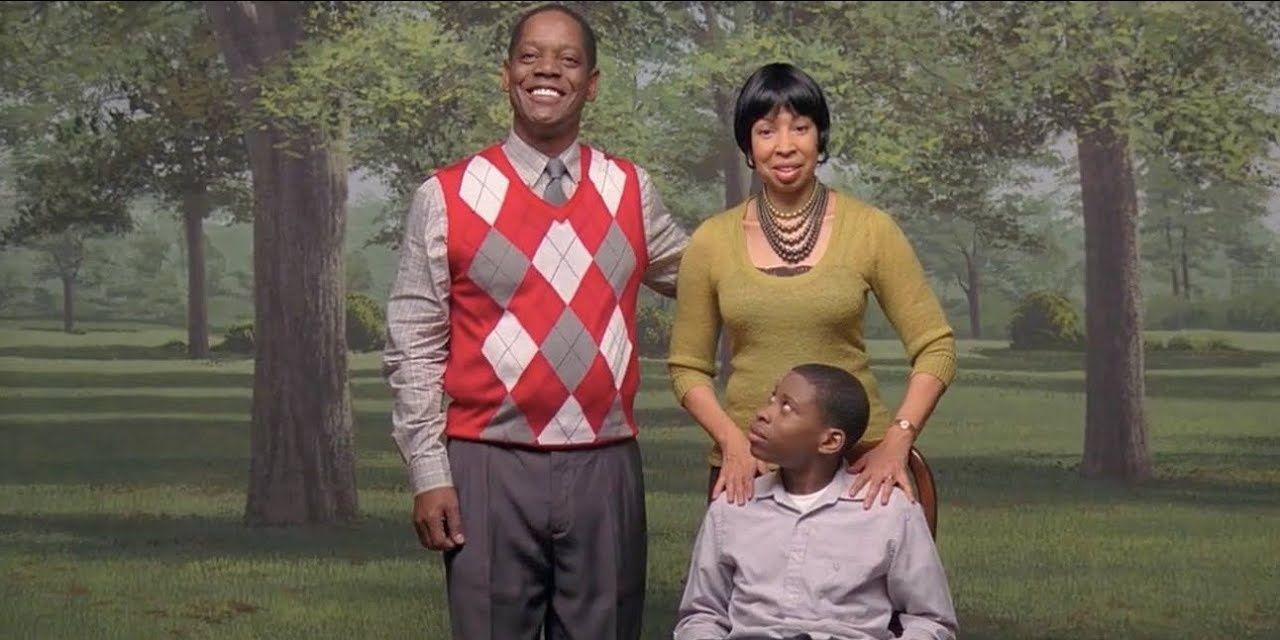 The Johnsons family. Isaiah stares up at Sidney with his mother's hands on his shoulders