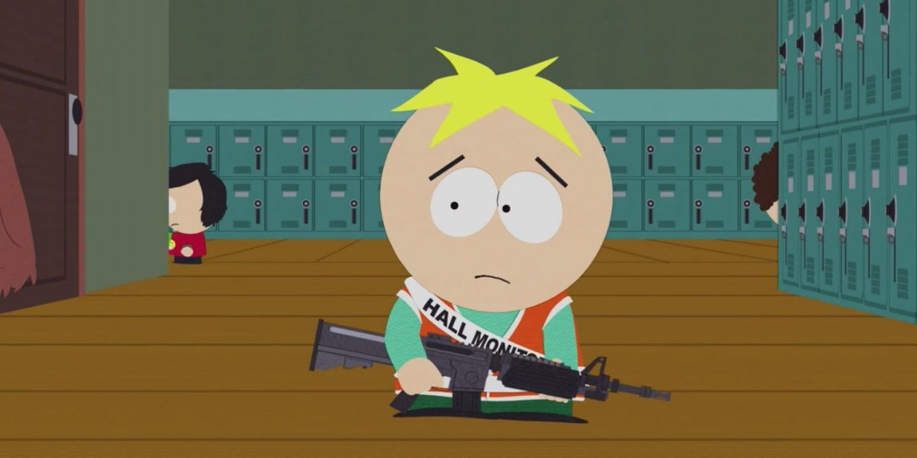 Butters holding a rifle in the middle of the school's hallway in South Park.