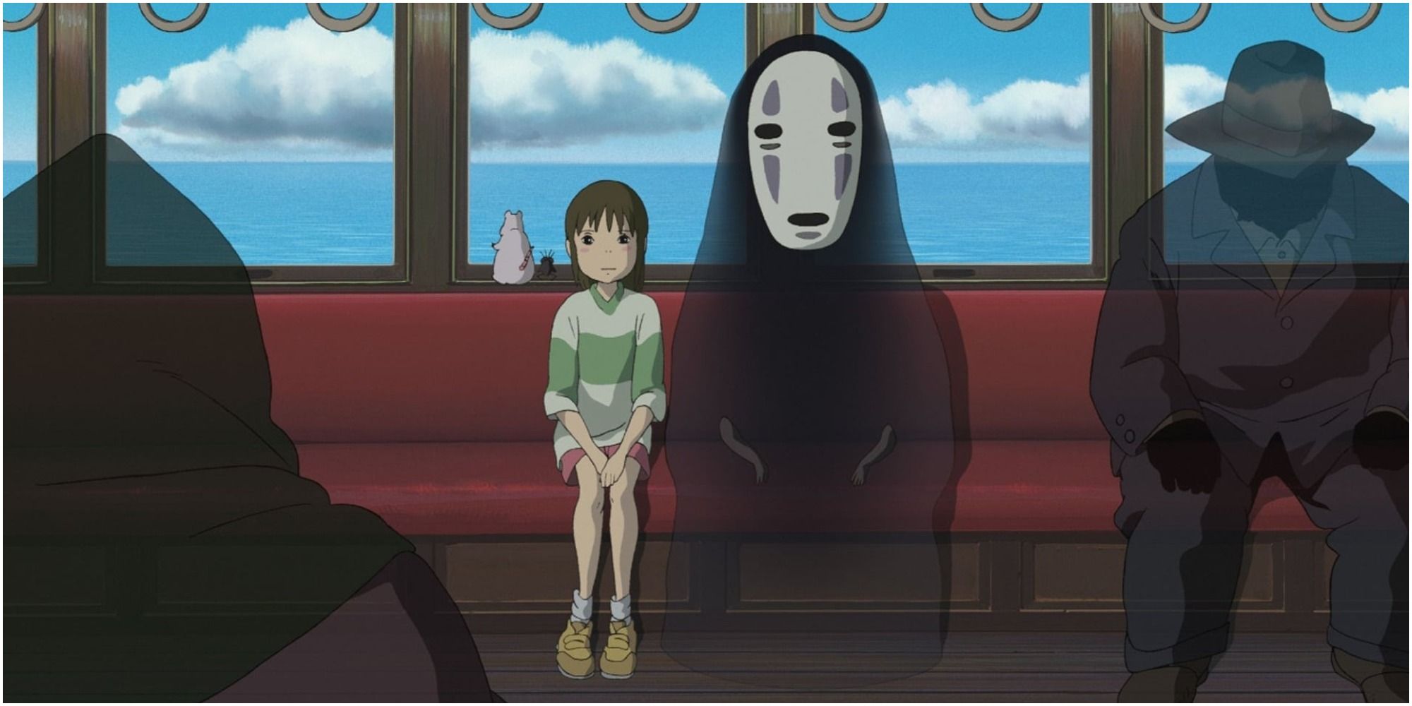 A girl rides a train inhabited by ghosts from Spirited Away 