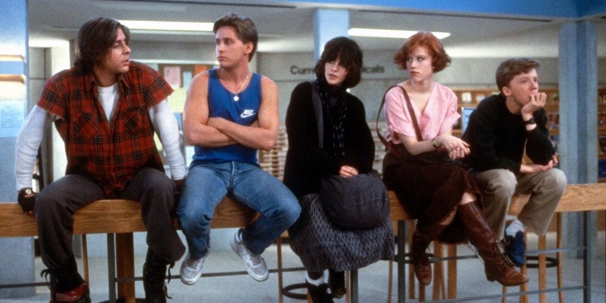 The Breakfast Club characters sitting on railing in detention 