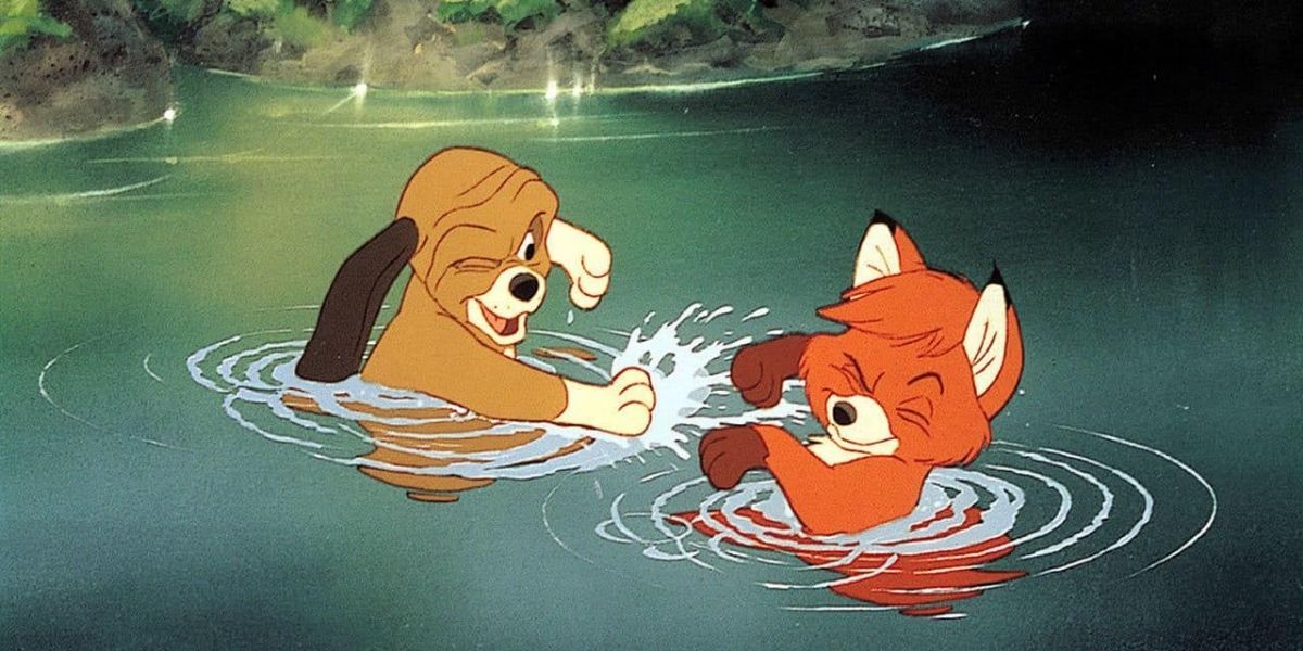 The Fox And The Hound play in the water