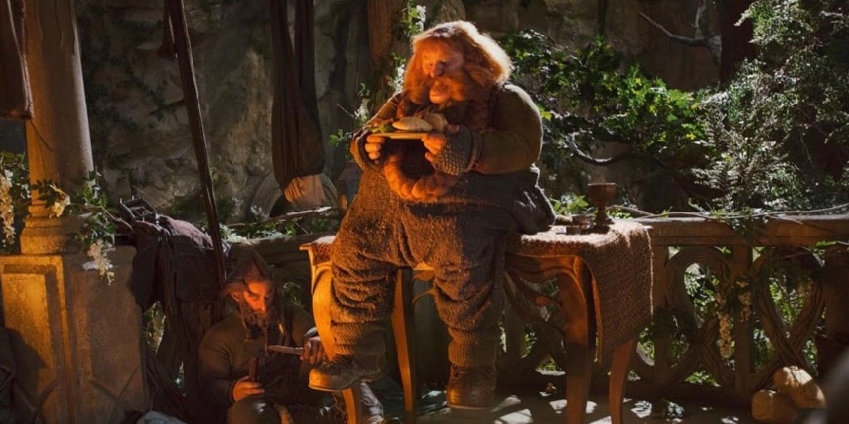 Bombur from The Hobbit movies sitting on a bench.