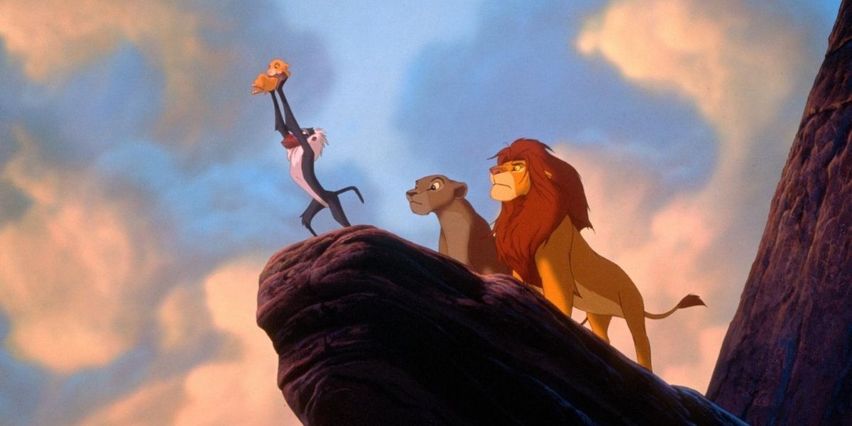 Rafiki lifts Simba up at Pride Rock in The Lion King (1994)