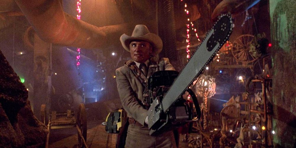 Dennis Hopper holding a chainsaw in The Texas Chainsaw Massacre 2