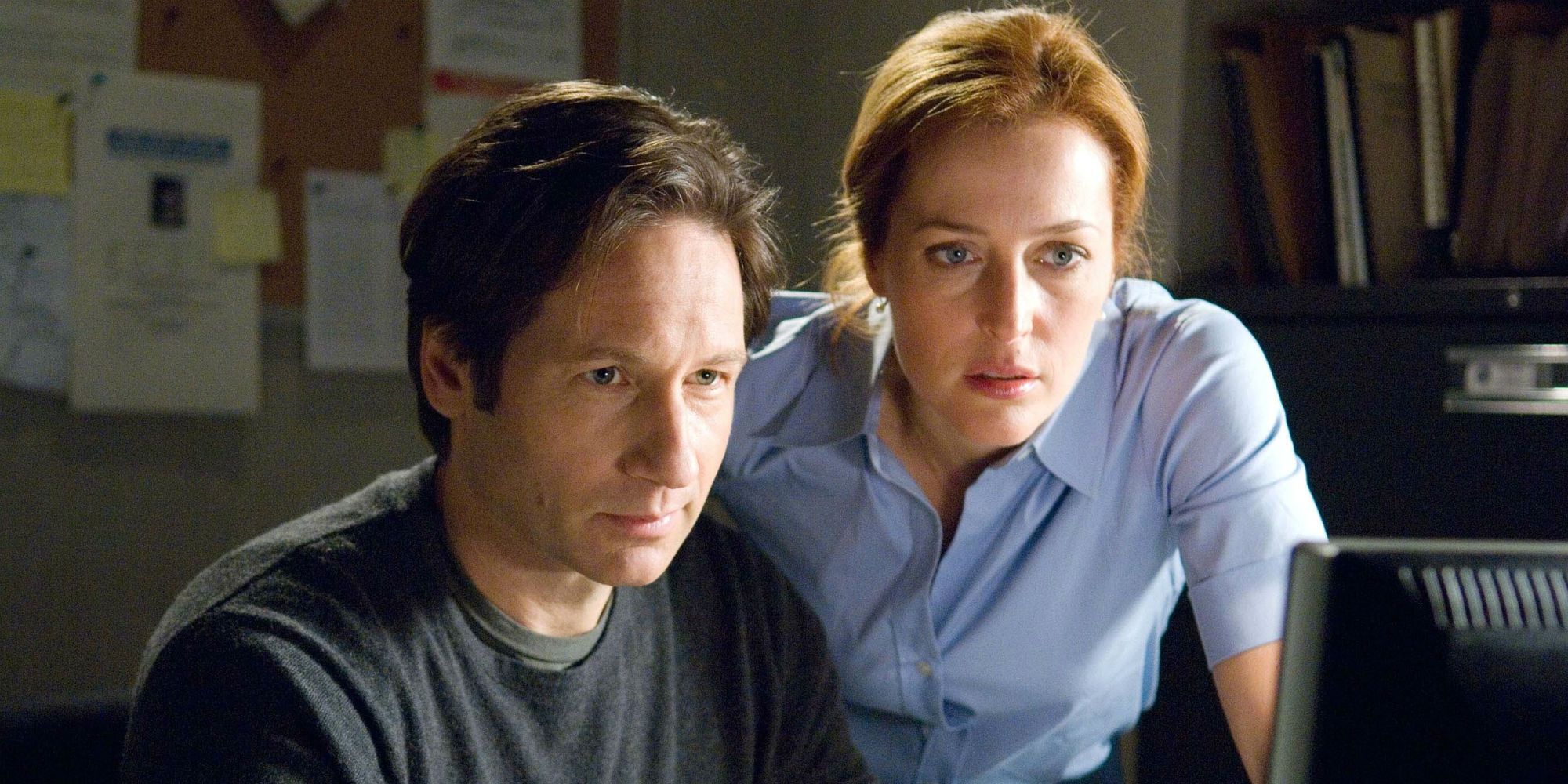 Mulder and Scully looking at a monitor in The X-Files I Want to Believe