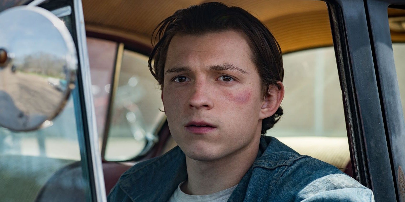 Tom Holland in a car in The Devil All The Time