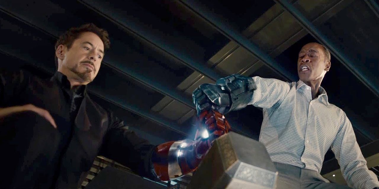 Tony and Rhodey try to bring Thor's hammer to life with the help of Iron Man's arm parts in Avengers: Age of Ultron