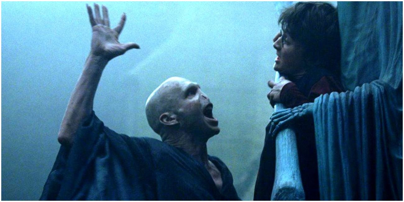 Voldemort reaches out to touch Harry's forehead