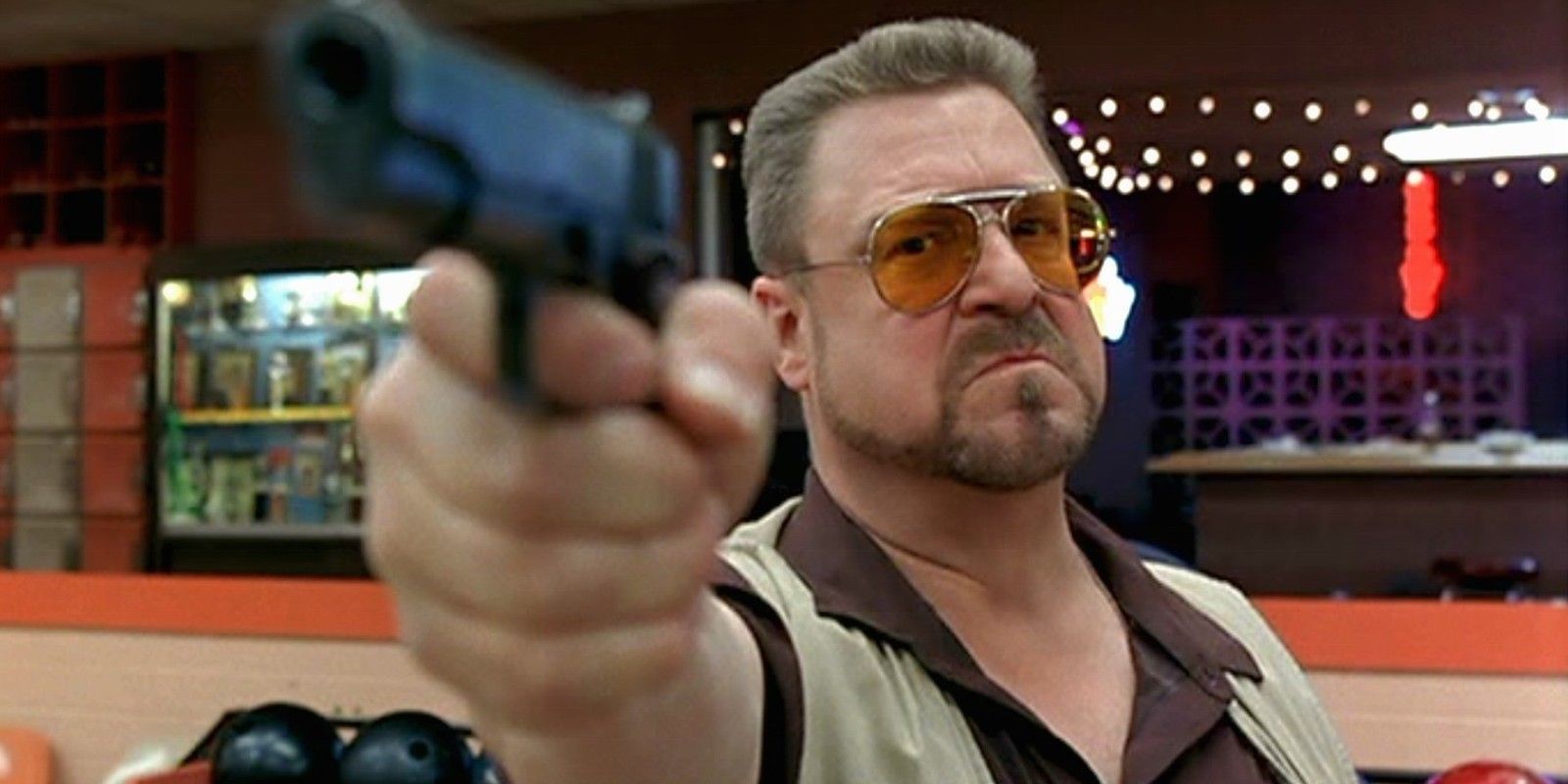 Walter points a gun in The Big Lebowski