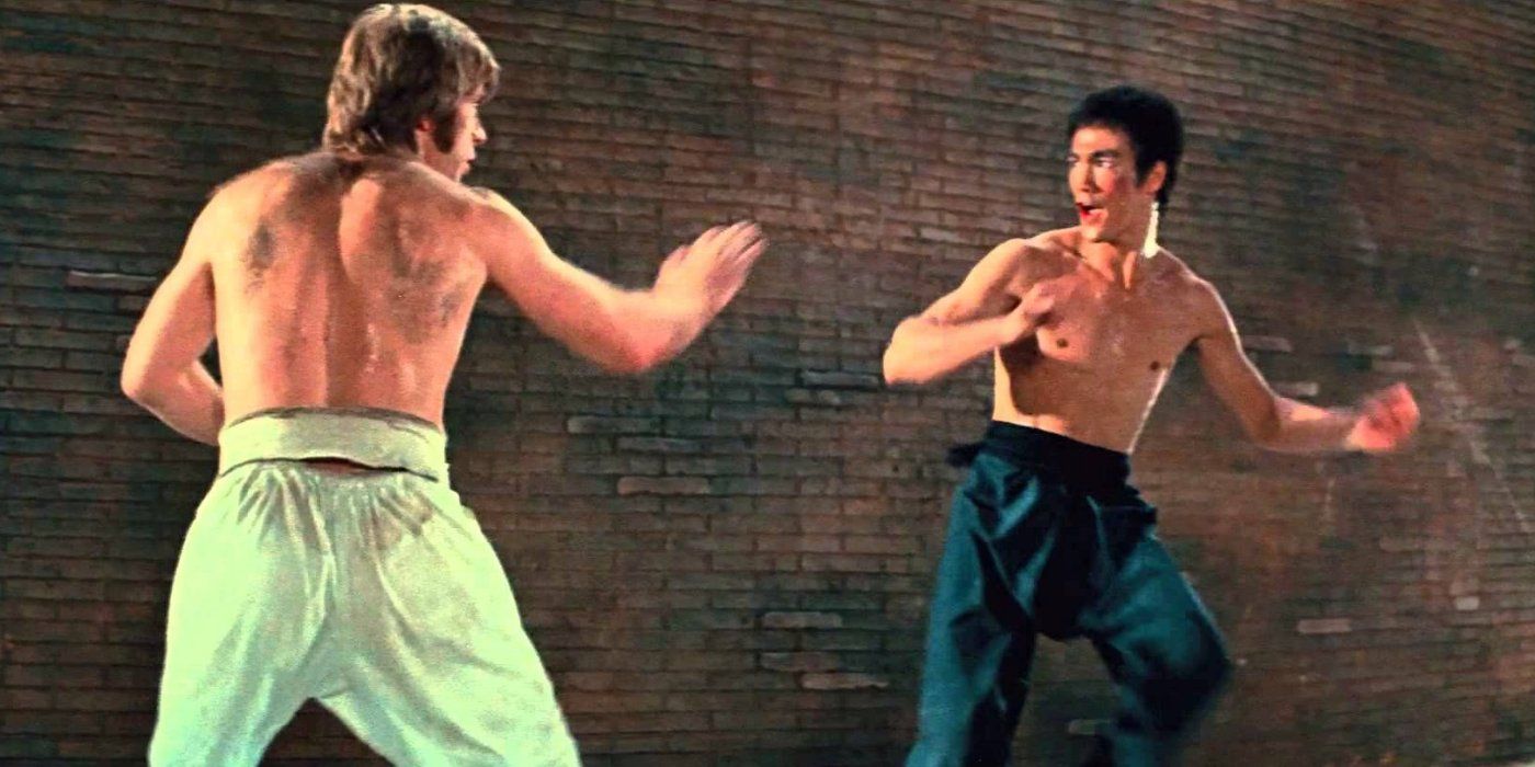 Chuck Norris and Bruce Lee preparing to fight in the way of the dragon