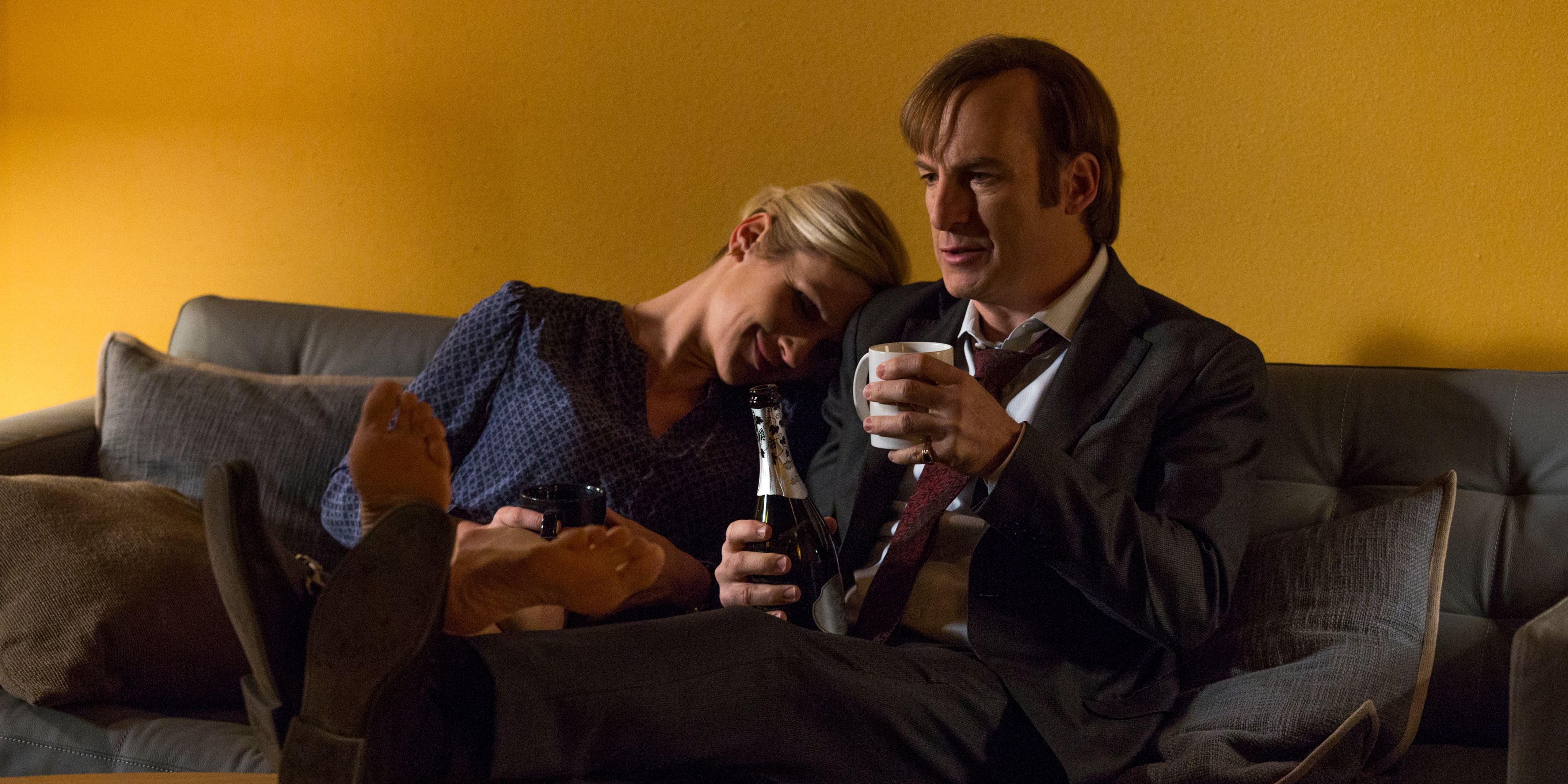 Kim and Jimmy cuddling on a couch in Better Call Saul