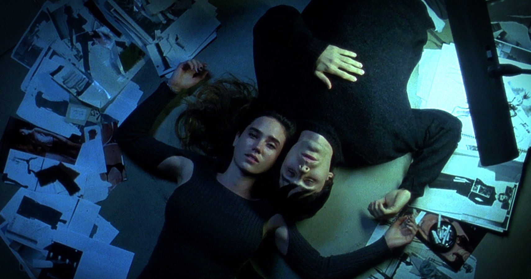 Jennifer Connelly and Jared Leto lie in a bed in Requiem For A Dream.