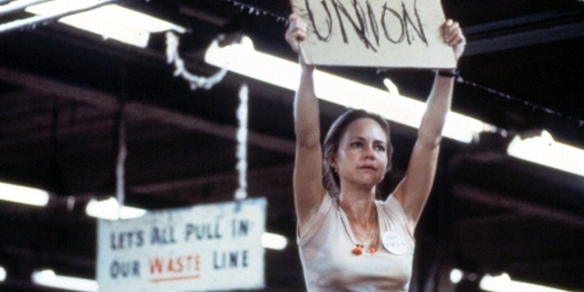 Norma Rae holds up an Union sign