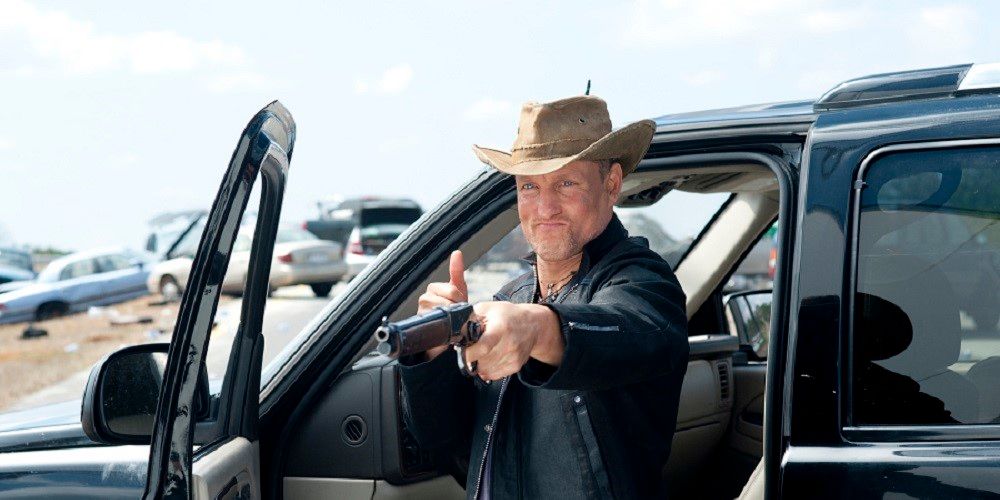 Tallahassee points a shotgun holds his thumb up in Zombieland