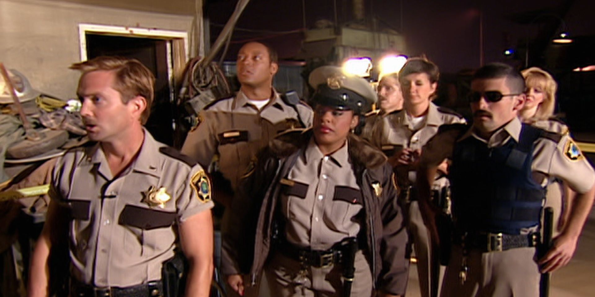 The cast of Reno 911 looking surprised