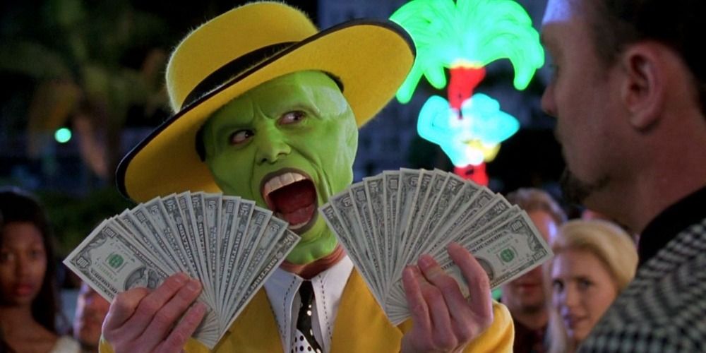 Jim Carrey as The Mask flashing a fan of money in front of the club in The Mask