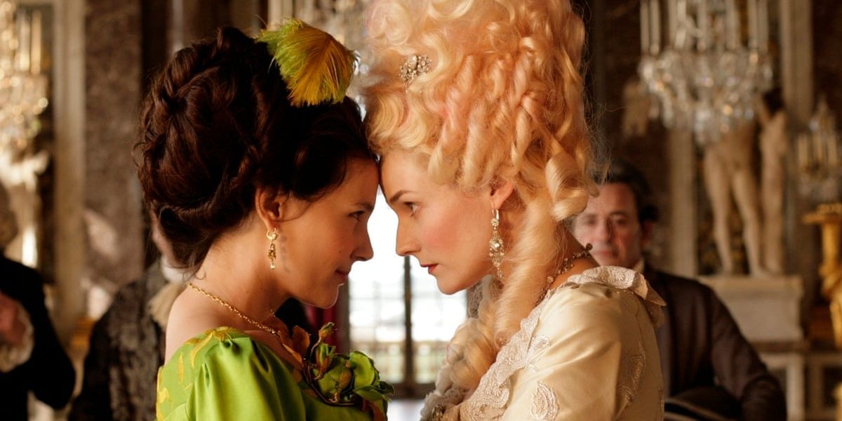 Farewell, My Queen: Marie Antoinette and Duchess de Polignac lean their foreheads together in the middle of a grand room