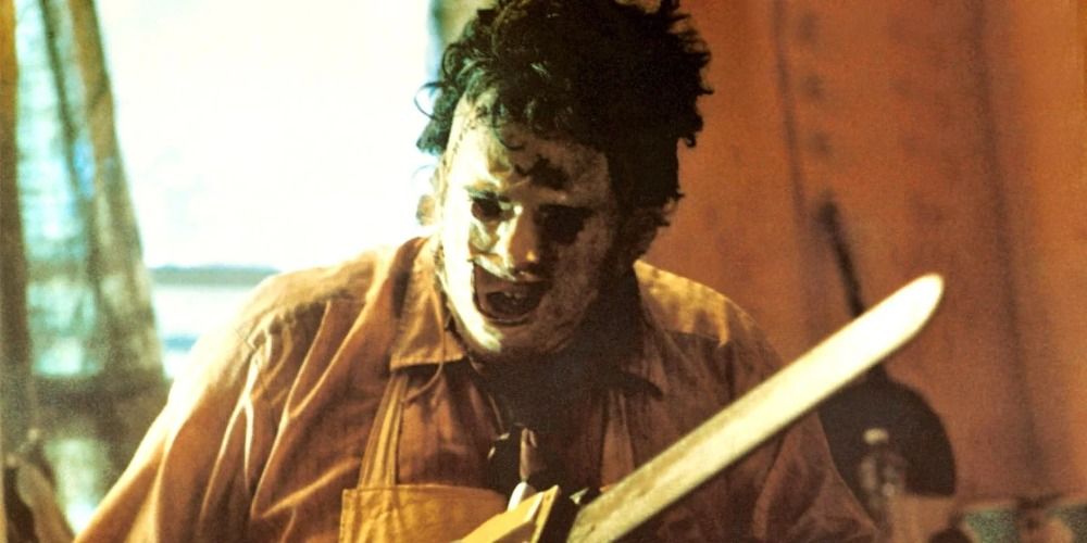 Leatherface holding a chainsaw in The Texas Chainsaw Massacre