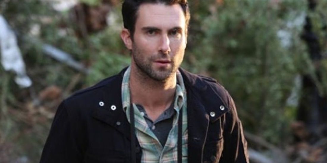 Adam Levine stands outside guest starring in AHS Asylum