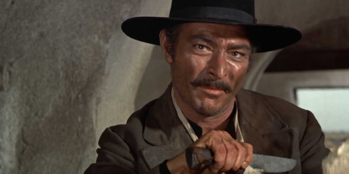 Lee Van Cleef as Angel Eyes holding a knife in The Good, the Bad, and the Ugly.