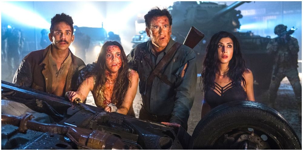 The cast of Ash vs Evil Dead covered in blood and staring at something shocking