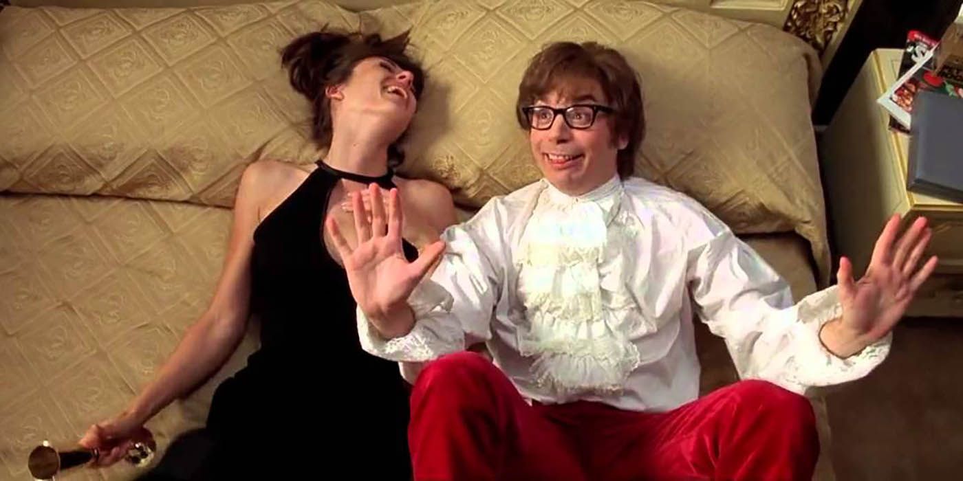 Austin Powers lays on the bed with Vanessa in International Man of Mystery