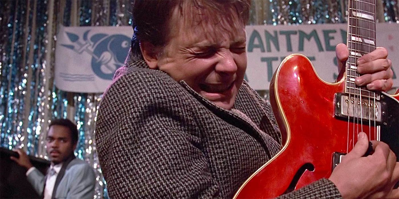 Marty playing the guitar in Back to the Future.