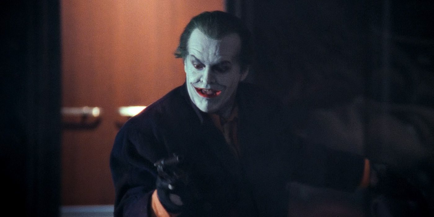 The Joker holding a pistol in Batman