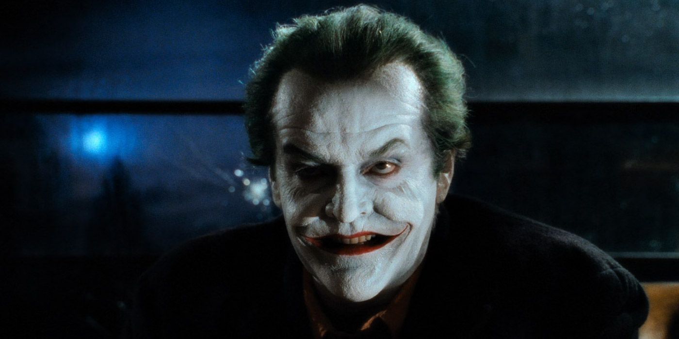 A close up of the Joker in Grissom's penthouse in Batman