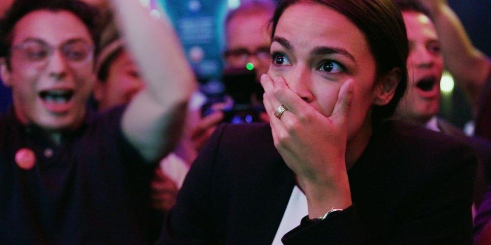 AOC in Knock Down The House with her hand over her mouth in surprise. 