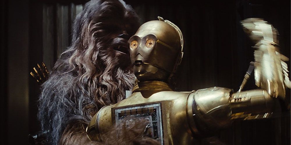 Threepio loses his cool on Chewbacca while Chewie carries his broken body away from the Ugnaughts in the Empire Strikes Back