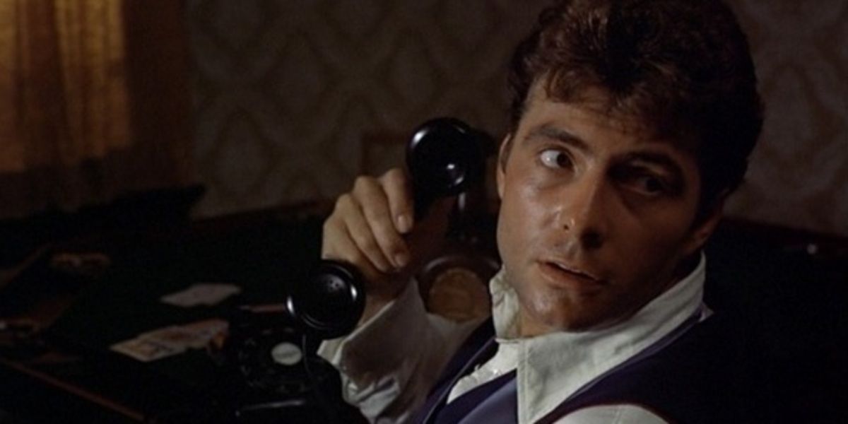 Carlo Rizzi speaks on the phone in The Godfather
