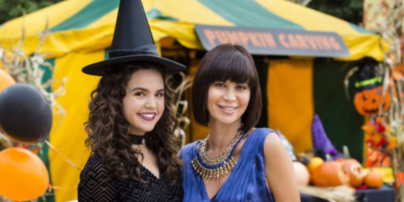 Cassie and her daughter Grace posing on Halloween in The Good Witch