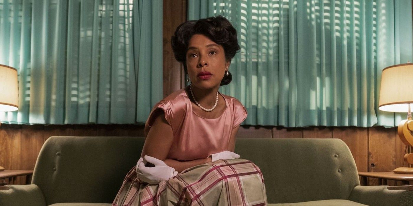 Charlotte (Sophie Okonedo) sitting and holding herself in Ratched season 1.