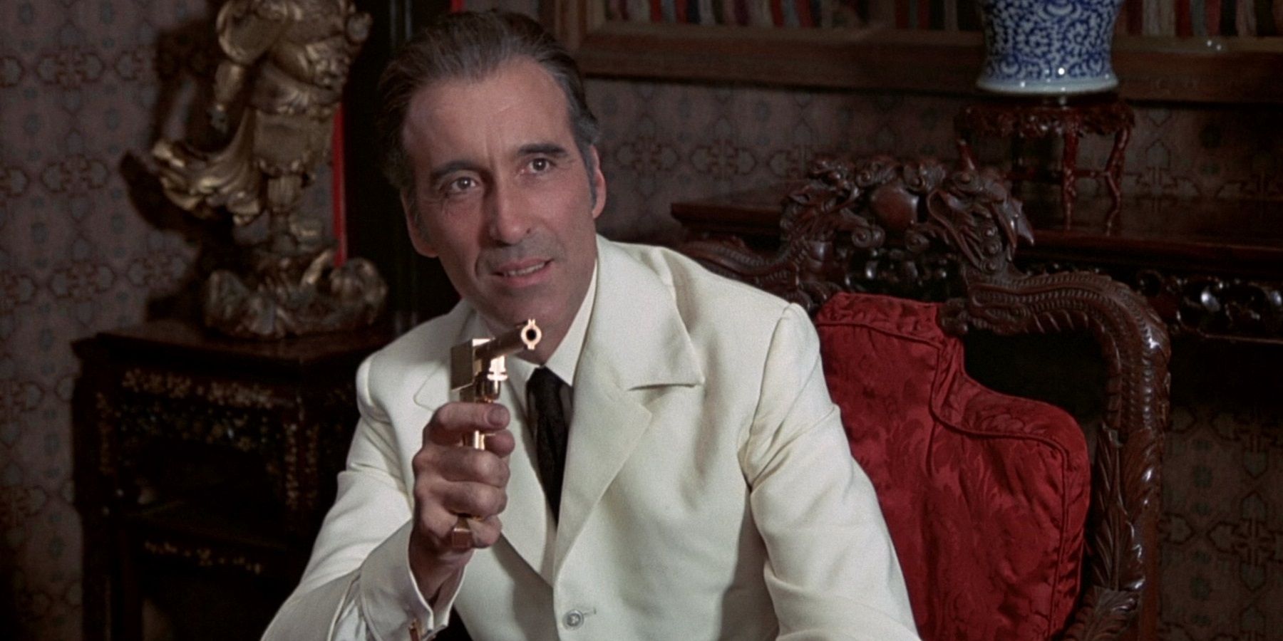 Christopher Lee with the titular handgun in The Man with the Golden Gun