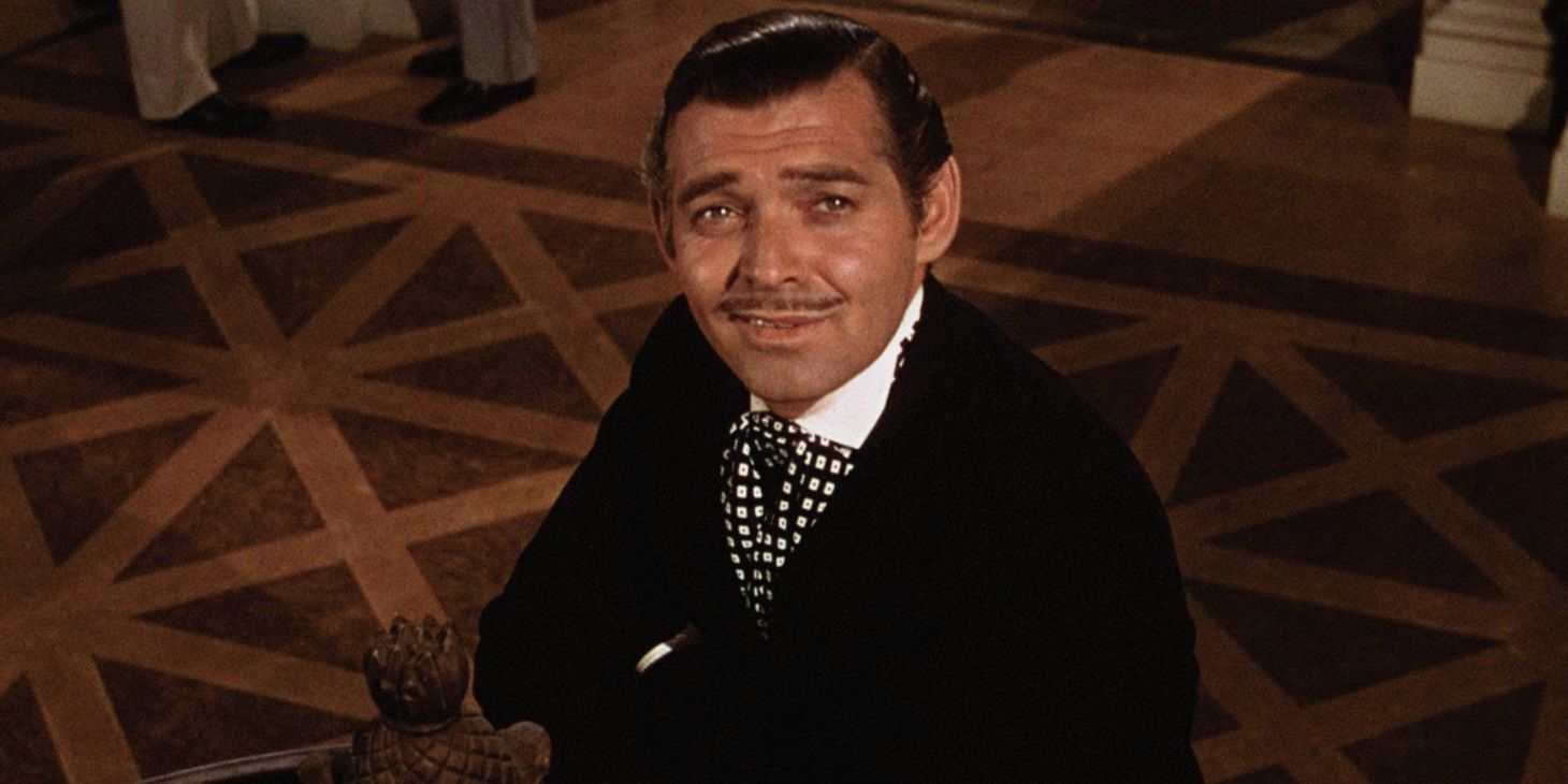 Rhett Butler looking up the stairs in Gone with the Wind