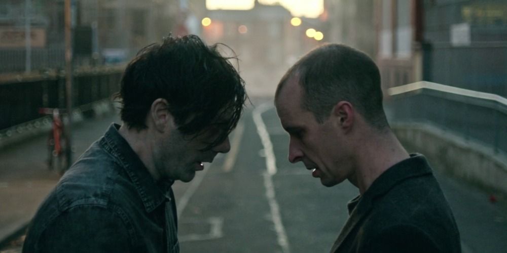 Conor face to face with a zombie and breathing together in the street in The Cured 2017