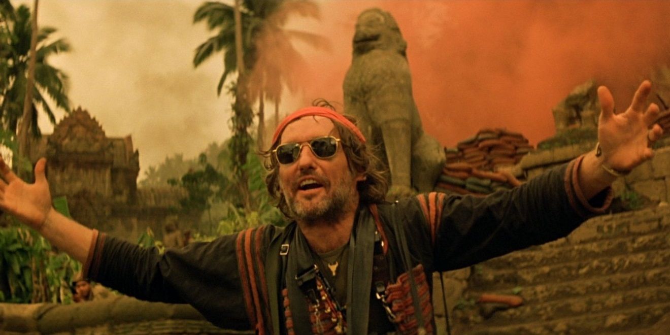 Dennis Hopper as Photojournalist, wearing sunglasses and a bandana in Apocalypse Now