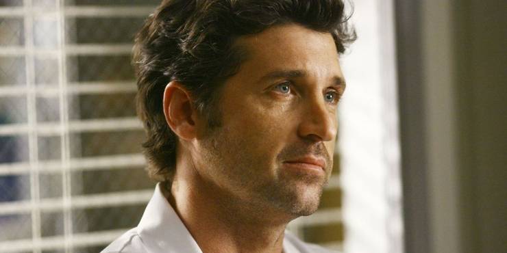 derek in front of blinds
