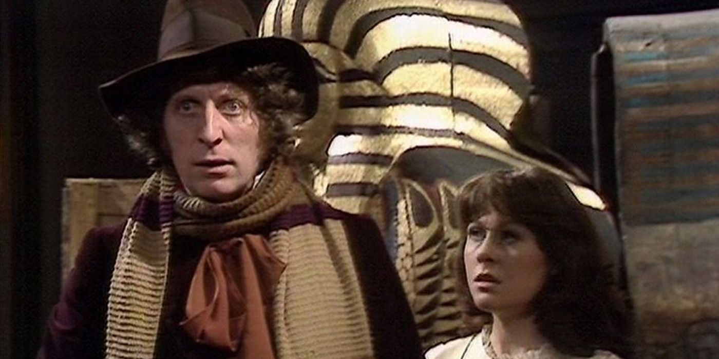 The Fourth Doctor and Sarah Jane Smith standing in front of a sarcophagus in Doctor Who: Pyramids of Mars