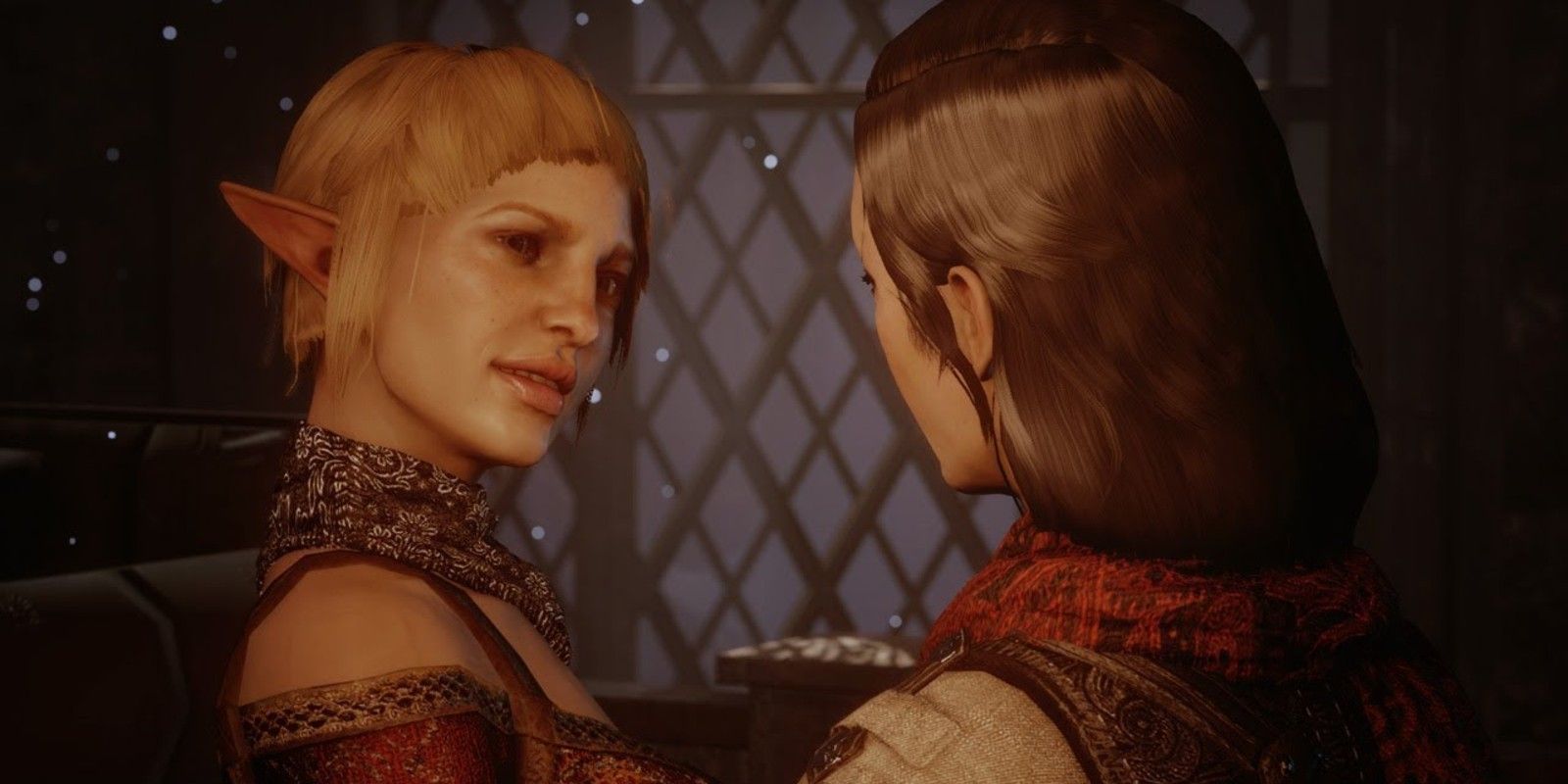 A female Inquisitor and Sera share a romantic moment at Skyhold in Dragon Age: Inquisition