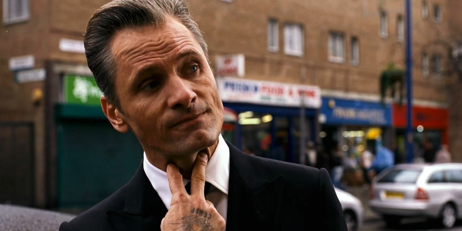 Nikolai holds his fingers to his throat in Eastern Promises