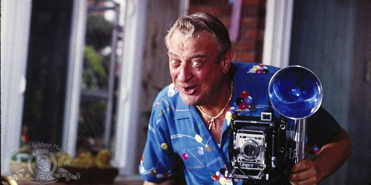 Rodney Dangerfield with a camera in Easy Money