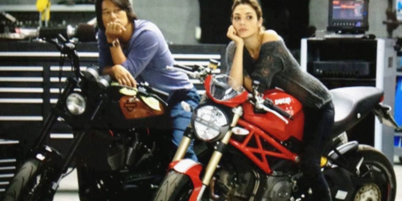 Han and Gisele lean on their motorbikes in Fast & Furious 6