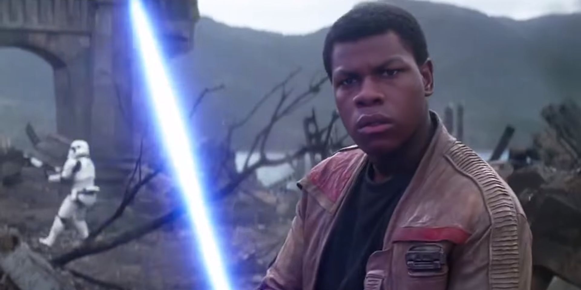 Finn wielding a lightsaber in Star Wars The Force Awakens