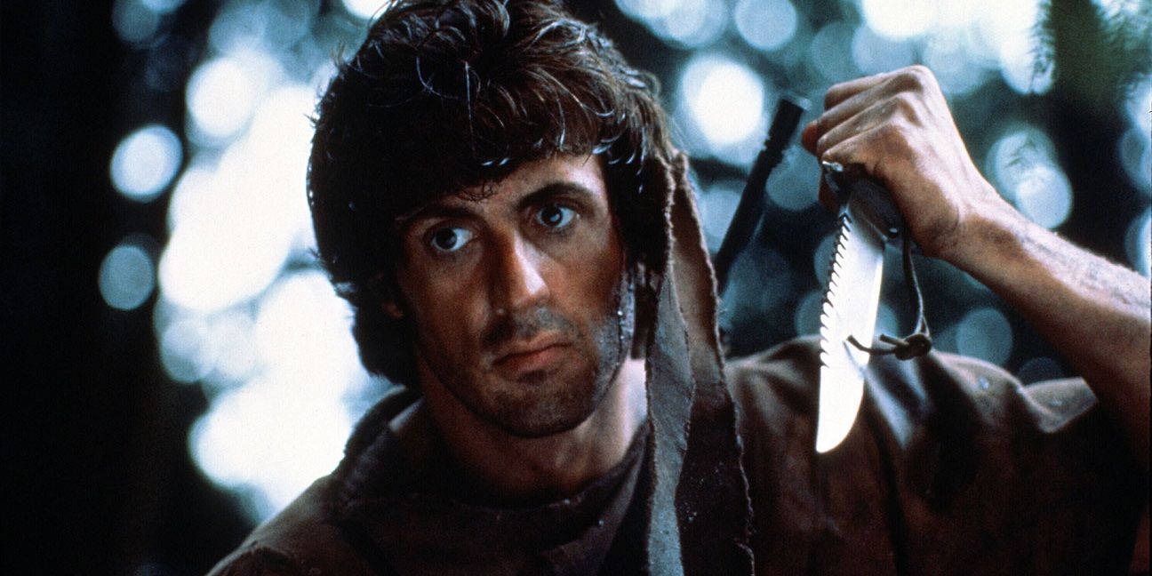 John Rambo holding a hunting knife in First Blood
