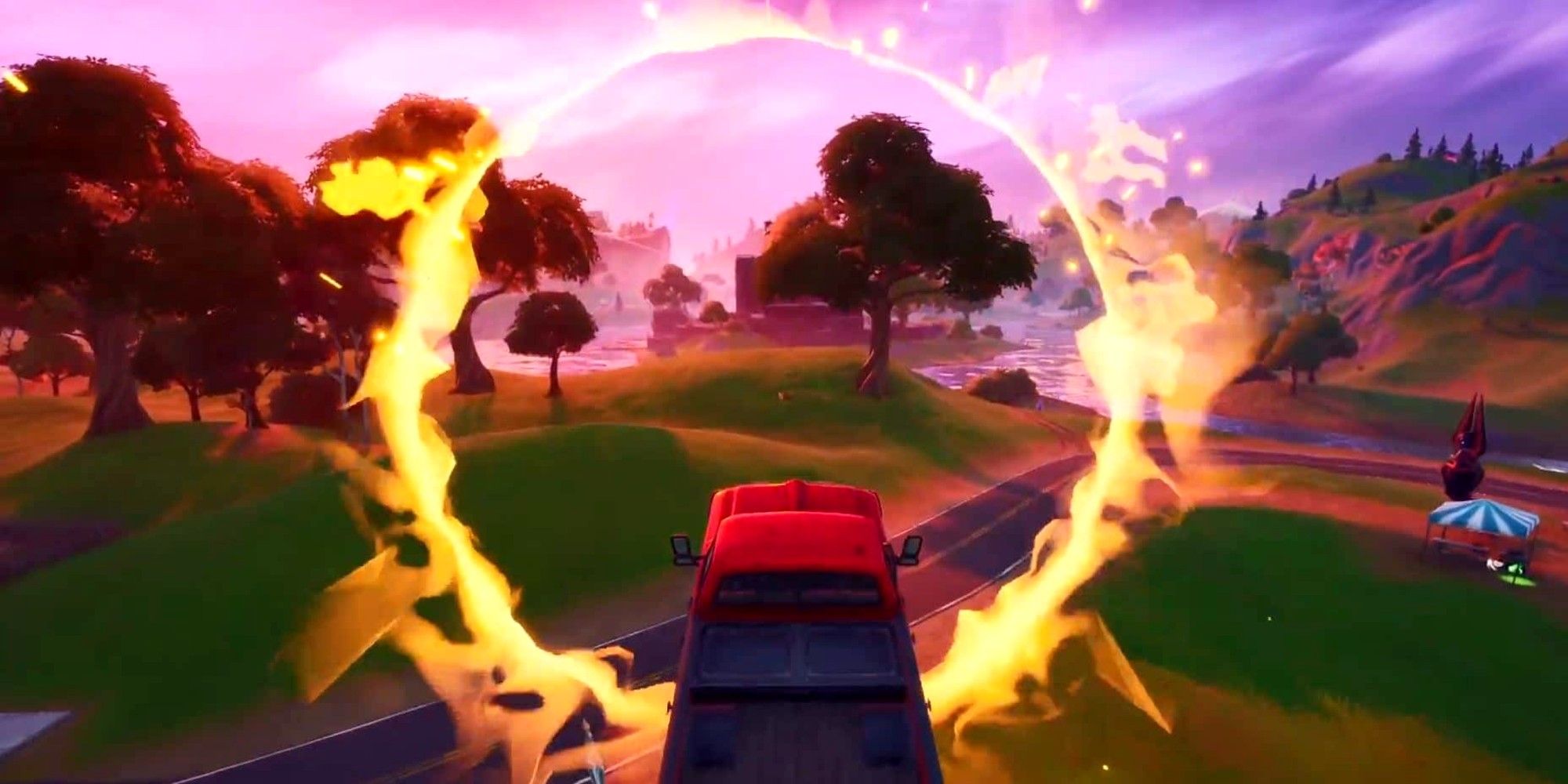 A player in a truck jumps through a Flaming Ring at Salty Springs in Fortnite
